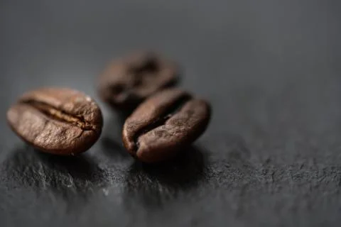 Coffee beans on black background close up Stock Photos