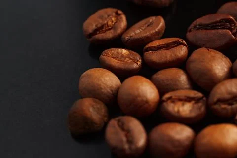 Coffee beans on a black background. Coffee on a black background with reflect Stock Photos