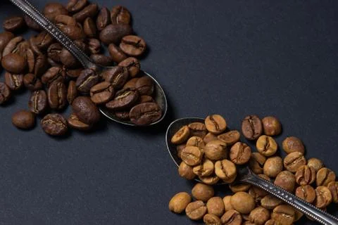 Coffee beans on a black background. Stock Photos