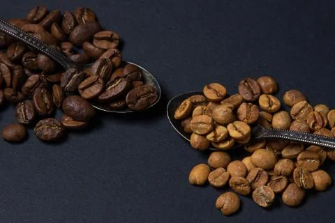 Coffee beans on a black background. Stock Photos