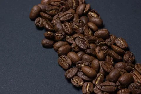 Coffee beans on a black background. Stock Photos