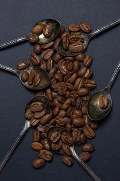 Coffee beans on a black background. Stock Photos
