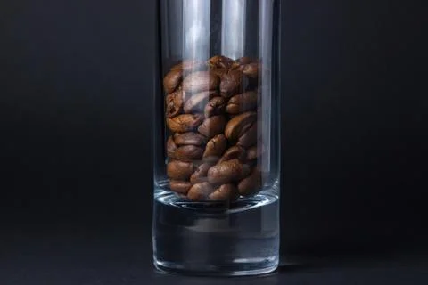 Coffee beans on a black background. Stock Photos