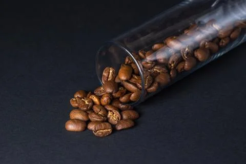Coffee beans on a black background. Stock Photos
