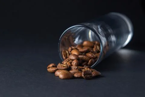 Coffee beans on a black background. Stock Photos
