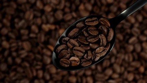 Coffee beans in black spoon. coffee beans background rotation right Stock Footage 129799121