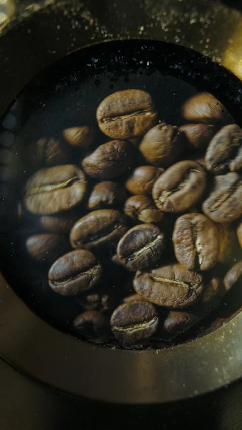 Coffee beans boiling in cezve Stock Footage 310541434