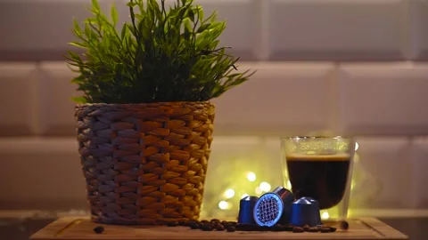 Coffee beans bounce around a cup of coffee Stock Footage 169395751