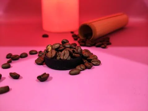 Coffee beans on a bright red background Stock Photos