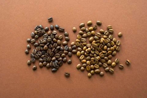Coffee beans on brown background close up Stock Photos