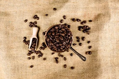 Coffee beans on brown, structured background Stock Photos