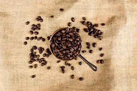 Coffee beans on brown, structured background Stock Photos