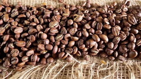 Coffee beans on burlap background Stock Footage 252928992