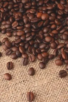 Coffee beans on burlap background Fotos de archivo