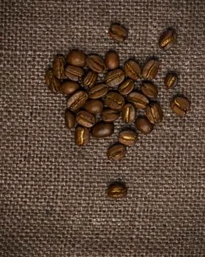 Coffee beans on burlap background 写真素材