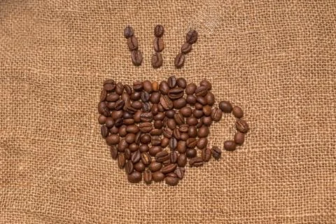 Coffee beans burlap fabric Stock Photos