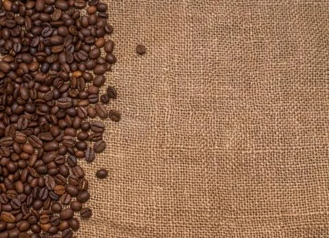 Coffee beans burlap fabric Stock Photos