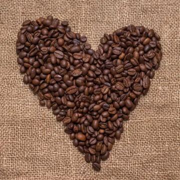Coffee beans burlap fabric Stock Photos