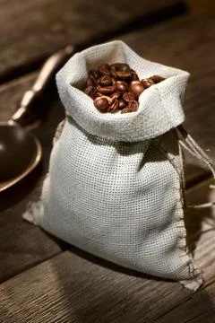 Coffee beans in the burlap sack Stock Photos