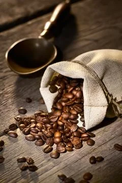 Coffee beans in the burlap sack Stock Photos