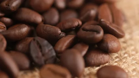 Coffee beans on canvas, cam moves , close up.Freshly roasted coffee on canvas Stock Footage 170357246