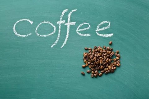 Coffee beans on chalkboard Stock Photos