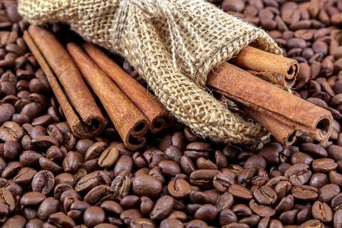 Coffee beans with cinnamon as a background Stock Photos