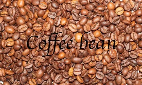 Coffee beans close-up in the background Stock Photos