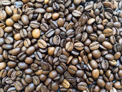 Coffee beans close-up in the background Stock Photos