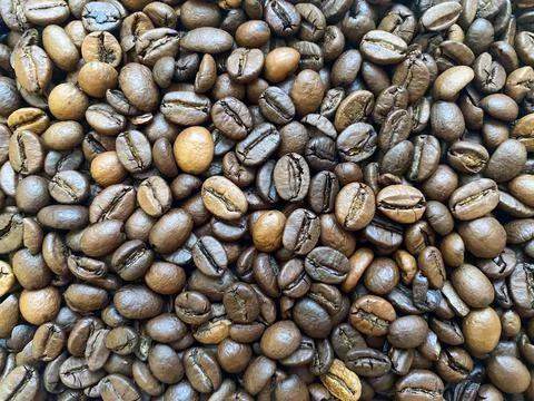 Coffee beans close-up in the background Stock Photos