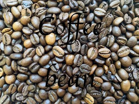 Coffee beans close-up in the background Stock Photos