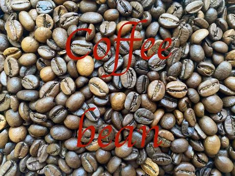 Coffee beans close-up in the background Stock Photos