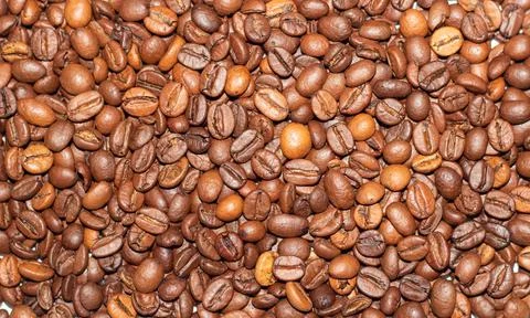 Coffee beans close-up in the background Stock Photos