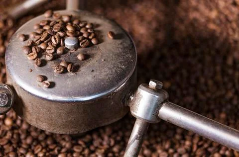 Coffee beans close-up in the coffee roaster Stock Photos
