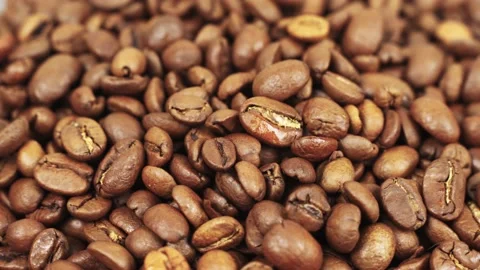 Coffee beans close-up rotate around an axis. Stock Footage 204074490