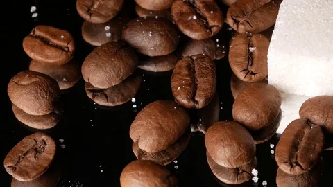 Coffee beans close-up rotate with a mirror image and a sugar cube Stock Footage 74775365