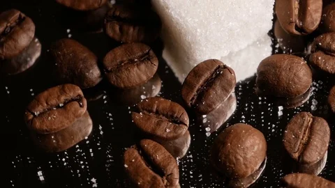 Coffee beans close-up rotate with a mirror image and a sugar cube Stock Footage 74775495