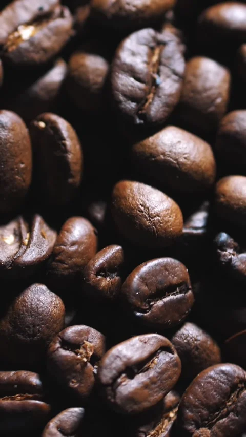 Coffee beans. close-up. Rotation. 360. top view. Dark, roasted fragrant coffee Stock Footage 319101598