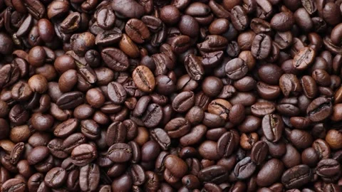 Coffee beans close up. Rotation of roasted coffee beans close-up. Stock Footage 220742190