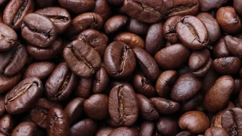 Coffee beans close up. Rotation of roasted coffee beans close-up. Stock Footage 220742289