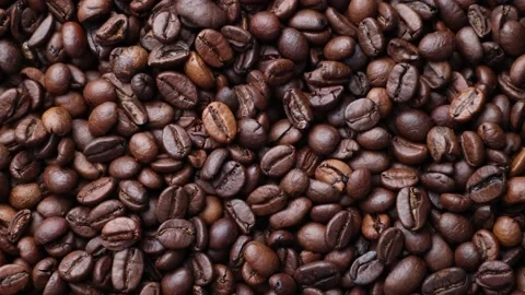 Coffee beans close up. Rotation of roasted coffee beans close-up. Stock Footage 220742312