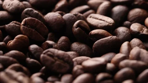 Coffee beans close up. Rotation of roasted coffee beans close-up. Stock Footage 220742317