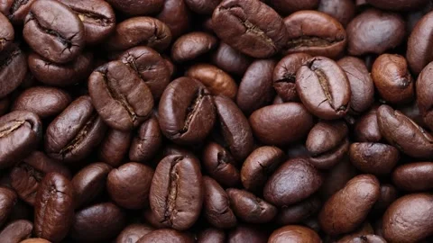 Coffee beans close up. Rotation of roasted coffee beans close-up. Stock Footage 220742369