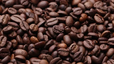 Coffee beans close up. Rotation of roasted coffee beans close-up. Stock Footage 220742469