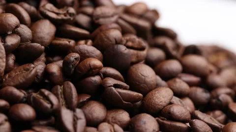 Coffee beans close up. Rotation of roasted coffee beans close-up. Stock Footage 220742470