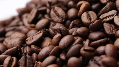 Coffee beans close up. Rotation of roasted coffee beans close-up. Stock Footage 220742483