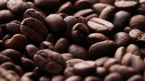 Coffee beans close up. Rotation of roasted coffee beans close-up. Stock Footage 220742573