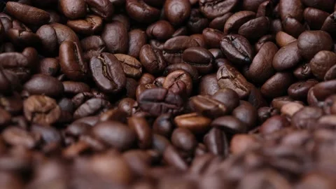 Coffee beans close up. Rotation of roasted coffee beans close-up. Stock Footage