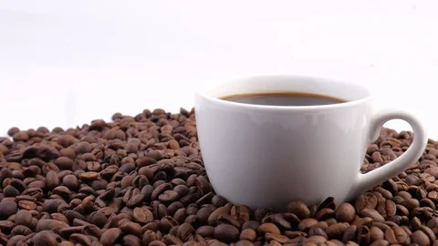 Coffee beans. Close up of seeds of coffee. Coffee on the white cup. 스톡 동영상 123379525