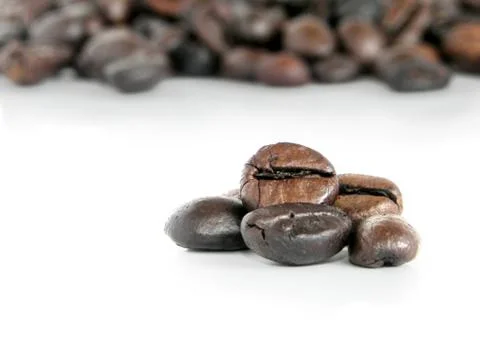 Coffee beans, closeup on white background Stock Photos